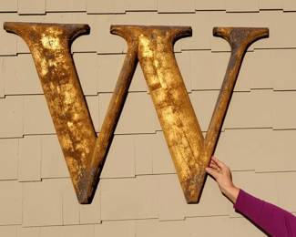 Large (63"x30") 1920's Heavy Cast Aluminum Letter W from the old Woolworth's Building in Detroit and still retains most of its gilt surface. It's been hanging on the outside of the home for quite some time, so it has a weathered look.