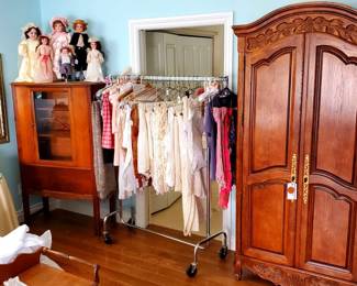 Antique dolls, Linens and Carved wood Armoire 