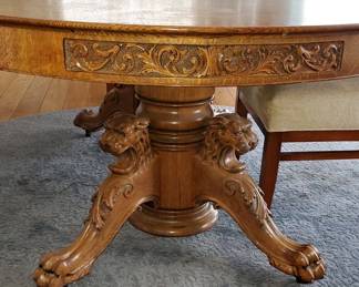 Incredible antique oak Dinning table with carved Lion heads and paw and carved on the edge sides of the table. with (5) Leaves. 