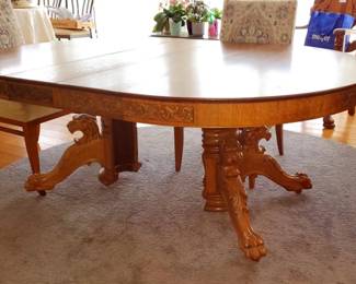 Incredible antique oak Dinning table with carved Lion heads and paw and carved on the edge sides of the table. with (5) Leaves. 