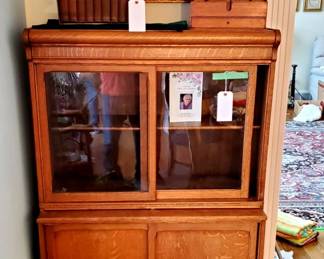1900's Oak Stacking Case cabinet with sliding doors and pull-out desk.