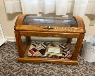 Glass quilt display chest; antique crazy quilt