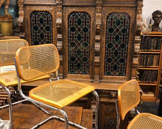Antique Belgium heavily carved cabinet with stained glass doors