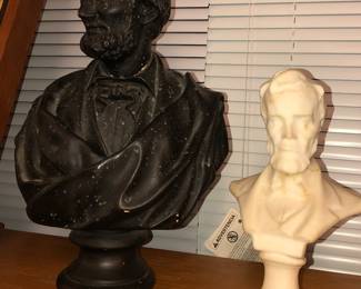 Two damaged busts of Lincoln