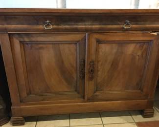 Handsome Walnut (?) cabinet with one drawer and storage below with two doors. Needs hinge repair.