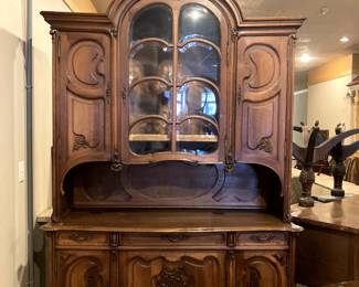 Fabulous French breakfront, early 20th century. Excellent condition! Two piece with beveled glass detail.