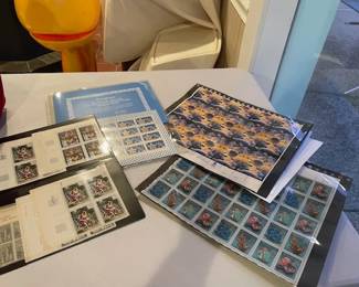 Postage stamps - in sheets and books.
