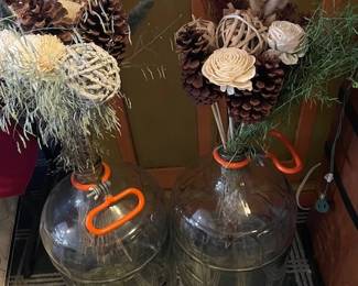 Glass water bottles with flowers.