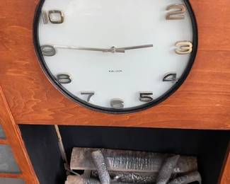 Rare Art Deco Streamline Fireplace Mantel, fitted with decorative fire logs (which light up). Side panels also light.