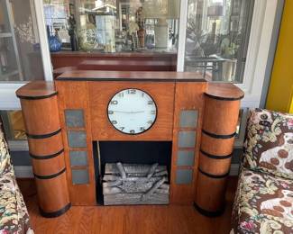 Rare Art Deco Streamline Fireplace Mantel, fitted with decorative fire logs (which light up). Side panels also light.