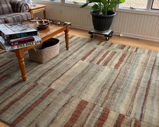 Nice large wool rug in earth tones