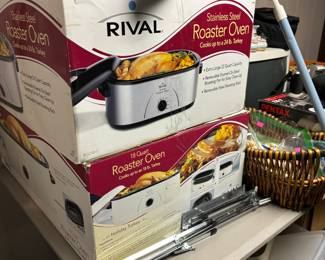 Two Rival electric roster oven. One new the other used only a few times