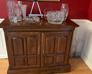 Server with crystal serving pieces and vases