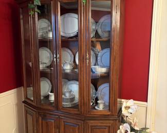 China Cabinet filled with dinnerware and wine glasses