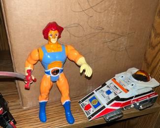 Obviously this is Lion-O from ThunderCats (not David Bowie going hard on the bronzer) and next to him is an early power rangers Bandai DY Jupiter.