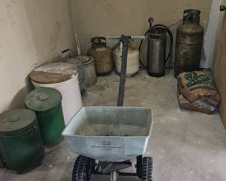 Propane tanks,  fertilizer spredder, pots