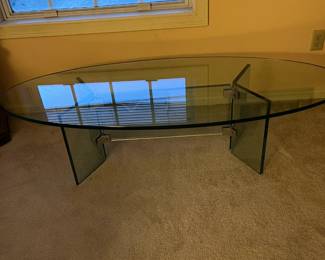 Heavy oval glass coffee table