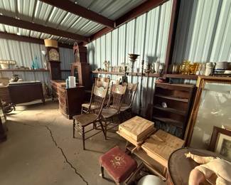 Antique grandfather clock, antique chairs, large framed mirrors, antique desks and victrolas.