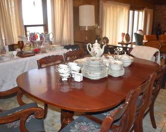 Dining set with matching hutch topped with beautiful antique china.
