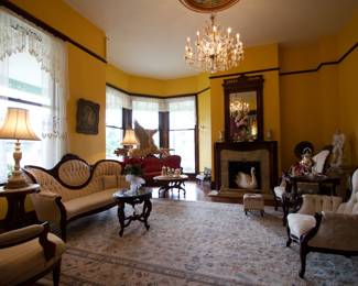 Main Parlor - Cream Victorian Couch and 2 matching side chairs, matching table lamps, Fireplace Mirror