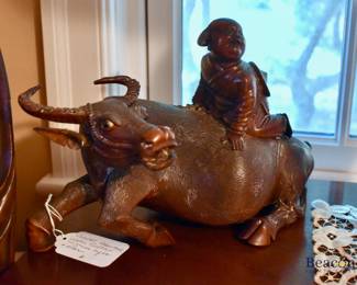 Carved water buffalo with rider