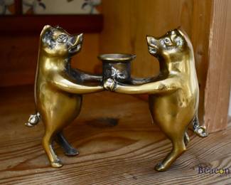 Brass pigs candlestick
