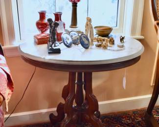 One of a pair of marble top Eastlake tables