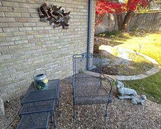 Outdoor wrought iron chair and set of nesting tables 