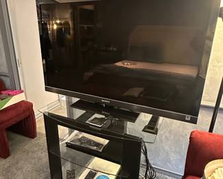Sony Bravia 46" TV; 4 glass shelf audio unit  