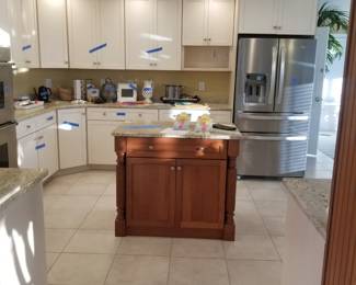 Kitchen cabinetry by Goebel Cabinetry. Large U-shaped kitchen with contrasting island