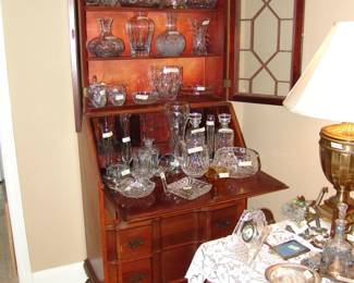 Secretary with crystal decanters and bowls
