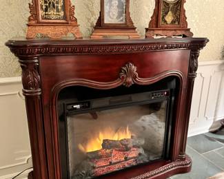 This electric fireplace lights up, heater blows warm air