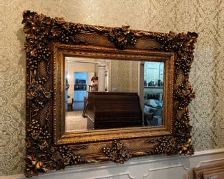 This mirror is HEAVY, stately, and very ornate.