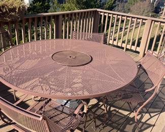 Iron patio set.  60 round.  4 chairs and bar cart 42 x18 x34.  $800