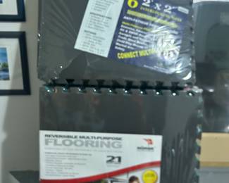 Several Packages of Rubber Tiles For Garages