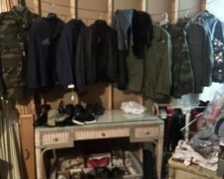 Men’s Jackets New. Wicker Desk. Mens and woman’s Shoes. Racks of Men’s and Womens(small) Clothing.