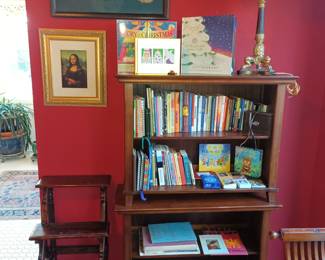 Bookshelves, vintage library step, lamps and embroidered peacocks
