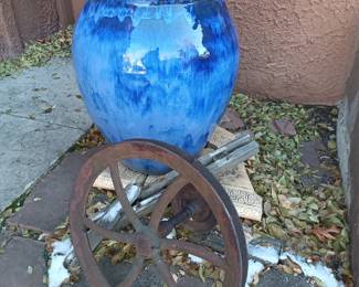 Large pot and iron wheel