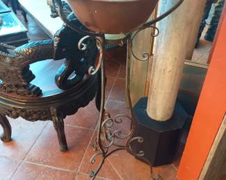 Bronze bowl on wrought iron stand