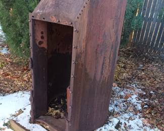 The doghouse. Nah, it's and old boiler.