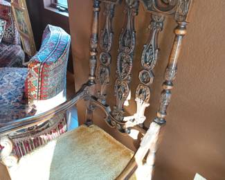 Again with the lovely high back carved wooded chair