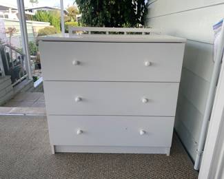 3 drawer dresser.  Laminate and in good condition with smooth roller-bearing drawer slides.