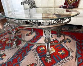 Oval glass and iron coffee table (48x33x22")