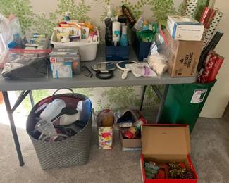 Misc plastic ware, christmas wrapping and personal cleaning and care products.  Boxes of bar soap.