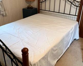 Wood and black metal full size bed