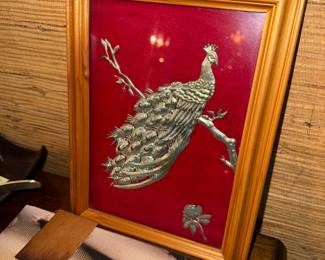 At first glance I thought those were roaches on the table. However after a second look I realize it is just a photo of shadows and an animal on a book cover. Now you can checkout the peacock picture.