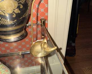 Not real sure but I see this little guy as a ring holder.