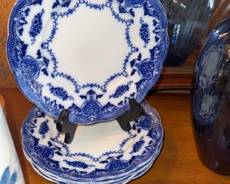 Set of five flow blue plates
