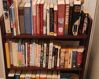 Variety of books and small bookcase