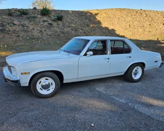 1976 Chevy Nova - Concours Model - 4 Door - Small Block 400hp Engine - White - Red Interior. Runs Great !